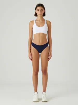 White Sports Bra + Blue High-Cut Sporty Thong + White Chunky Sneakers
